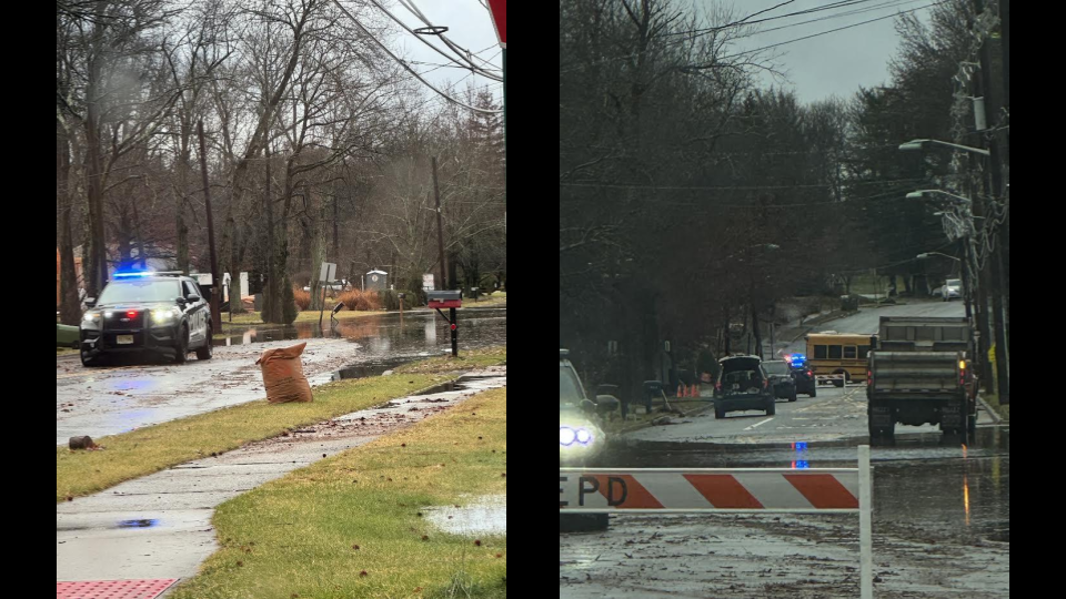 A police road closure due to flooding is seen in front of J.P. Stevens High School and Polansky Park in Edison, N.J. ZFJ/Zoe Wu