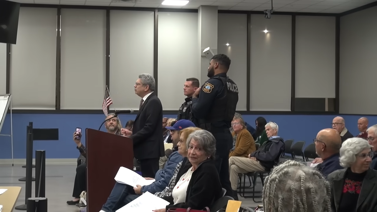 Edison Town Council ejects man for holding American flag